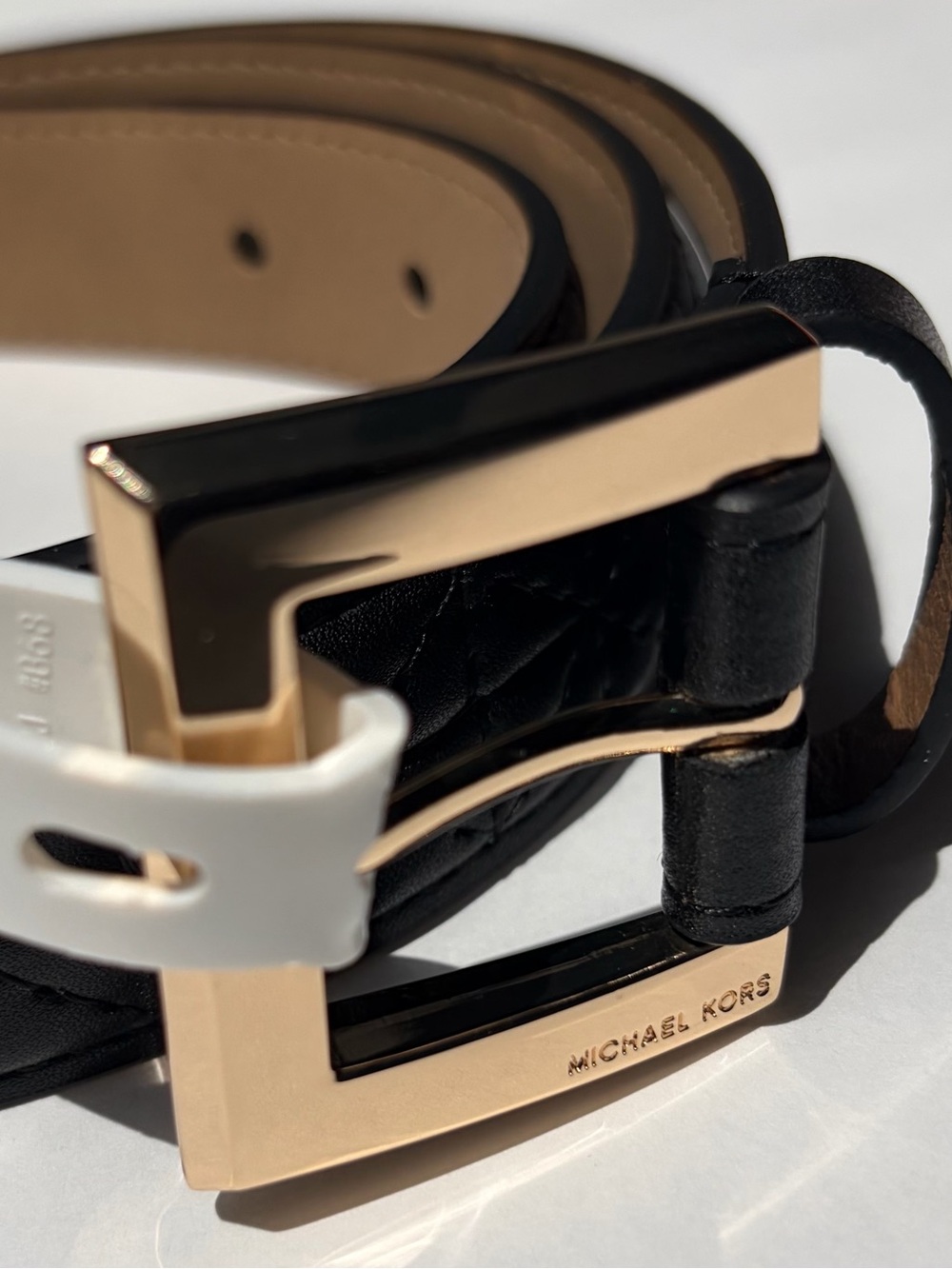 Michael Kors Black Quilted Leather Belt with Gold toned Buckle.